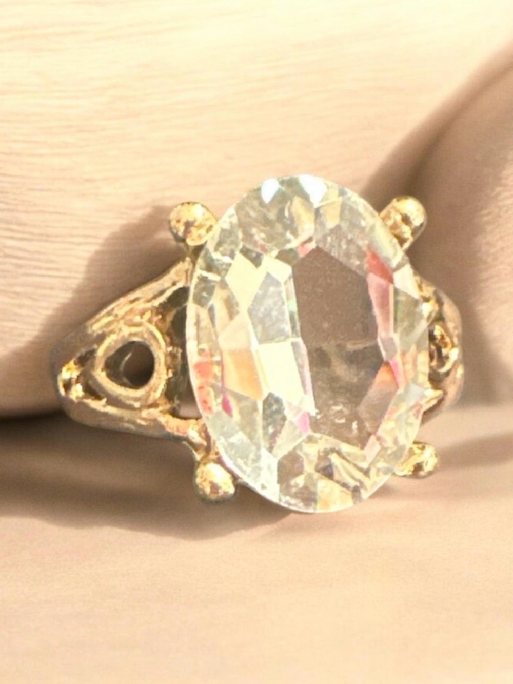 Elegant Gold-Tone Ring with Clear Oval Crystal